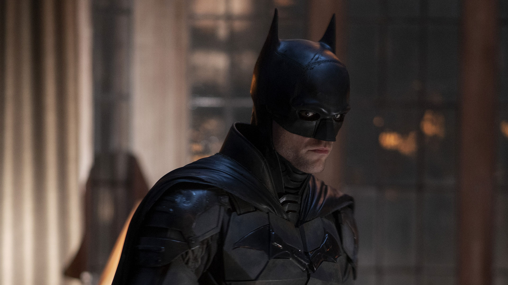 Robert Pattinson as Batman Robert Pattinson in the dark armored Batman suit from the 2022 film